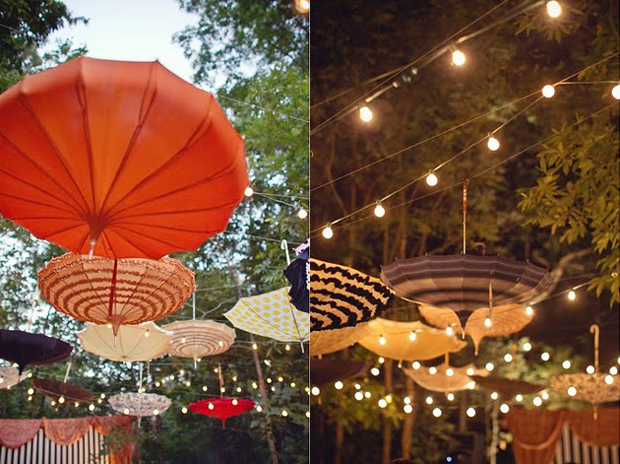 Genius idea at this old circus themed wedding vintage umbrellas creating a